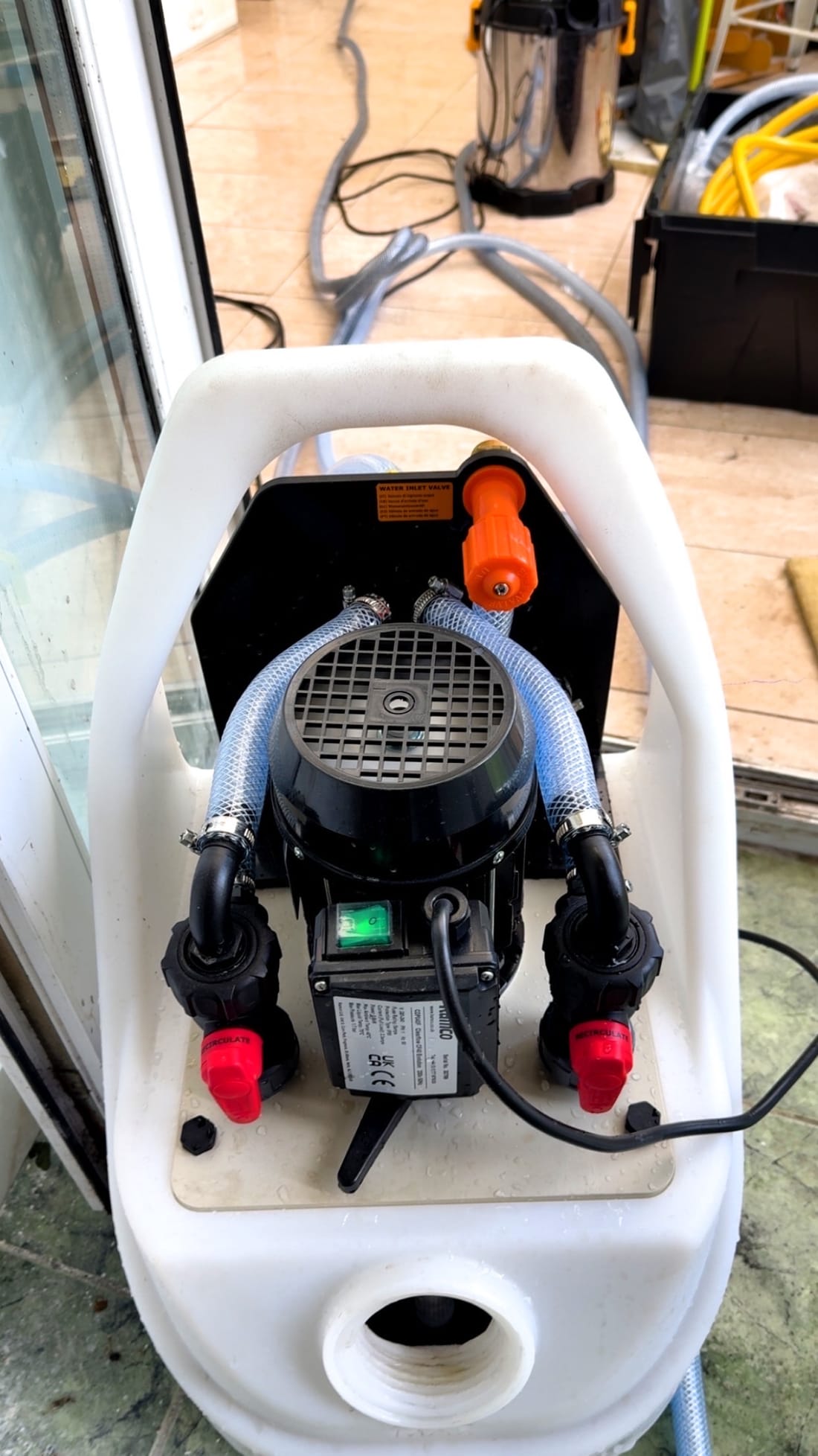 Power flush pump connected up and running on a London central heating system