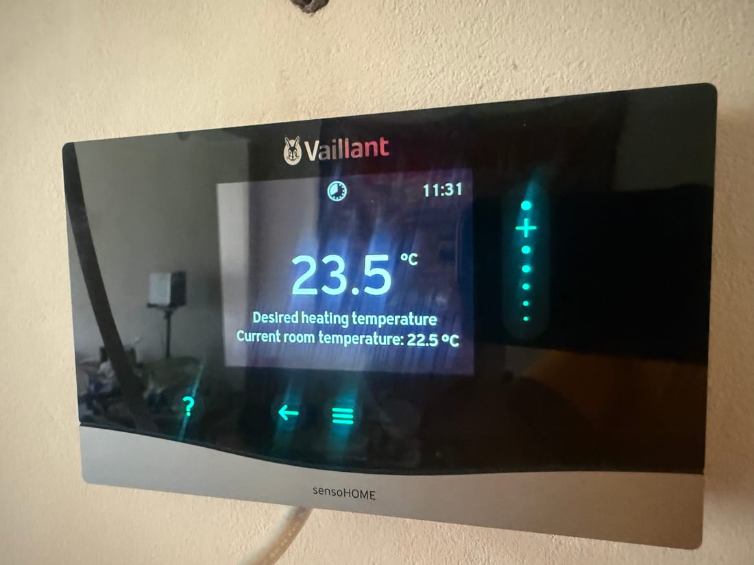 Smart thermostat we installed on the wall of a London home, showing the current and target room temperature
