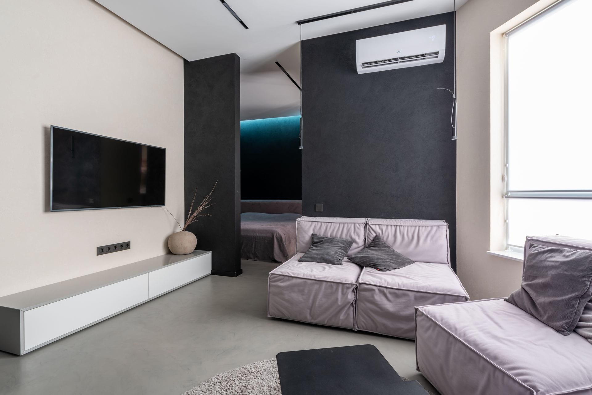Wall-mounted air conditioning unit in a living room