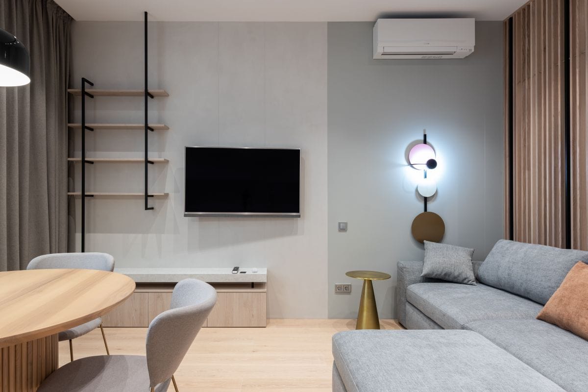 Wall-mounted split air conditioning unit in a modern living room