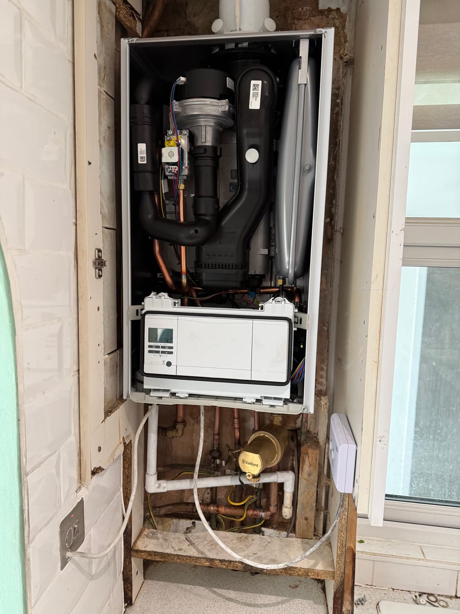 Boiler opened up for an annual service with internal components exposed