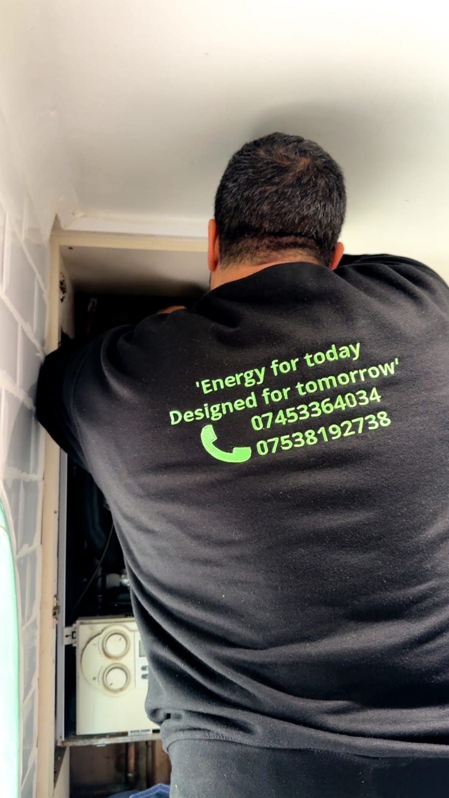 Future Home Energy engineer in branded workwear installing a boiler