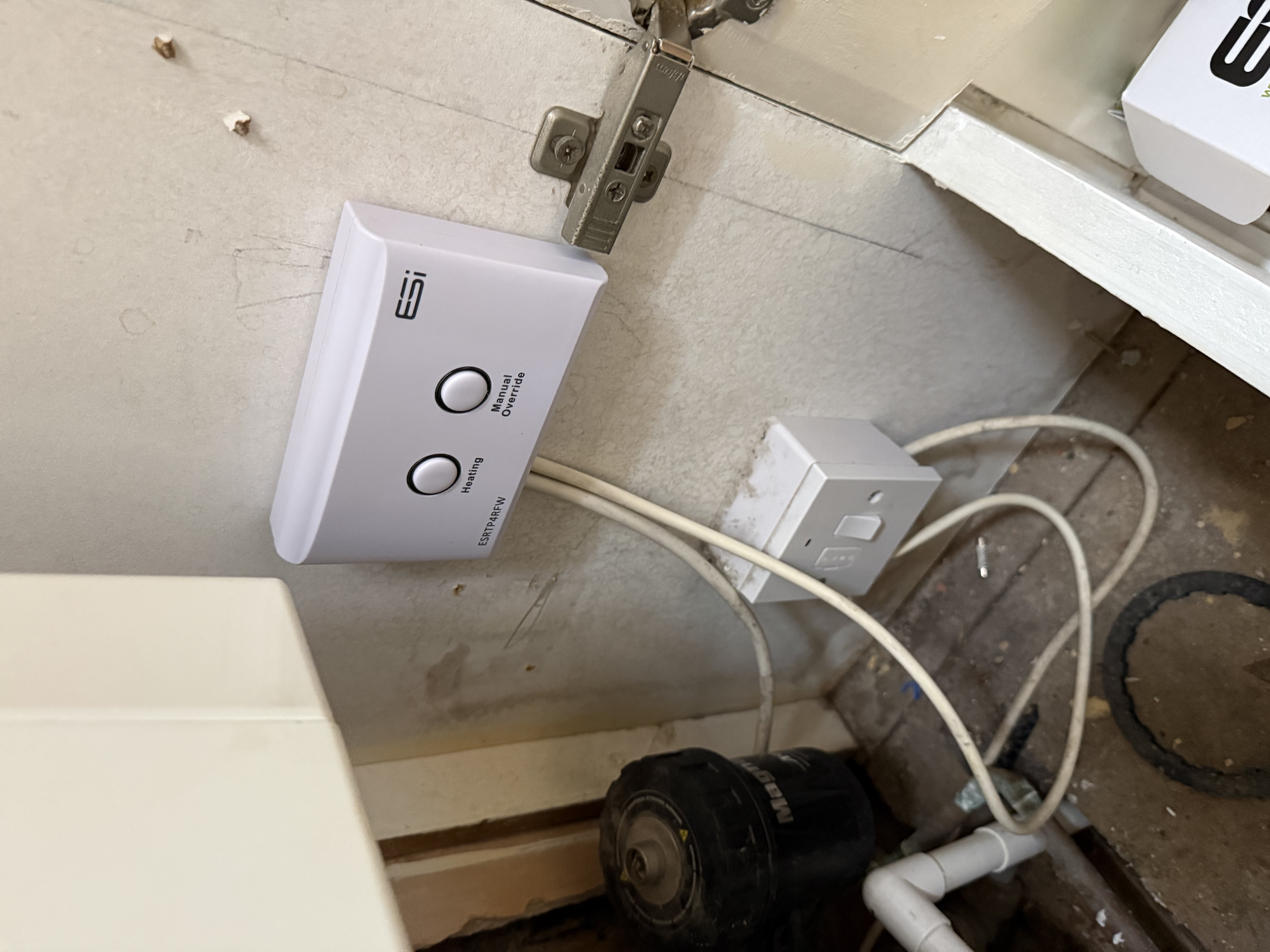 Heating controls and pipework inside a boiler cupboard