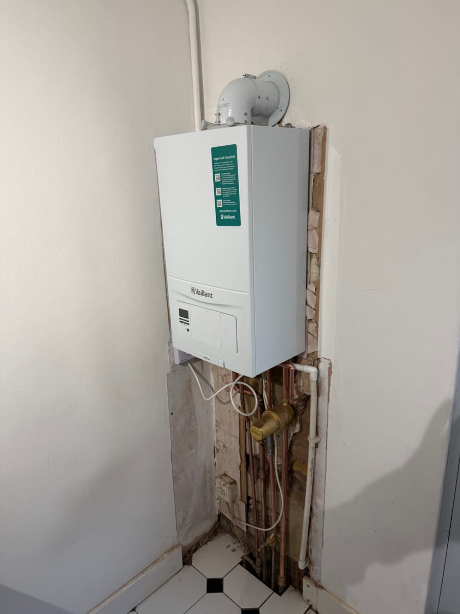New Vaillant combi boiler with copper pipework before the casing is boxed in