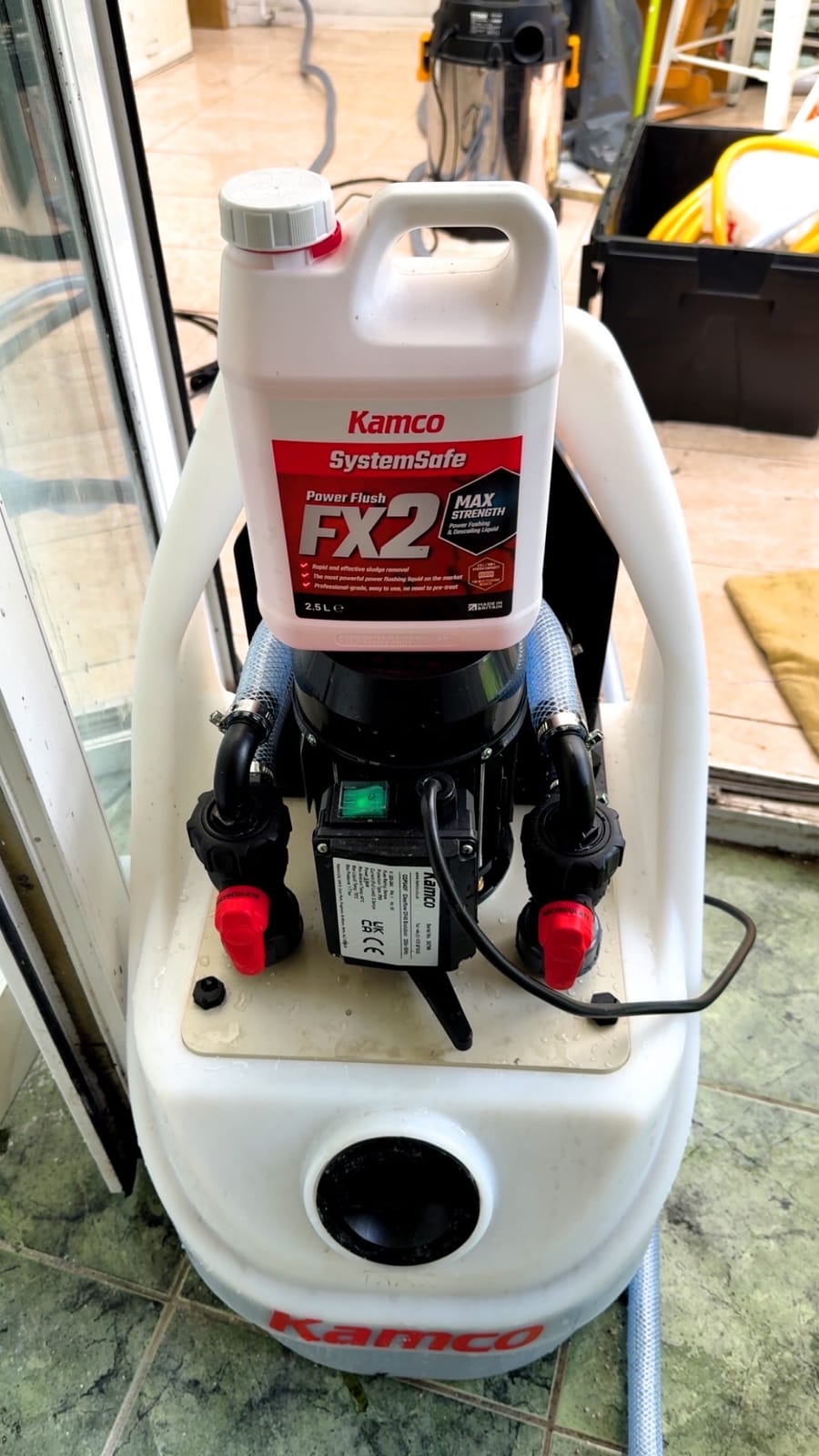 Power flush pump and cleaning chemical set up for a central heating system flush